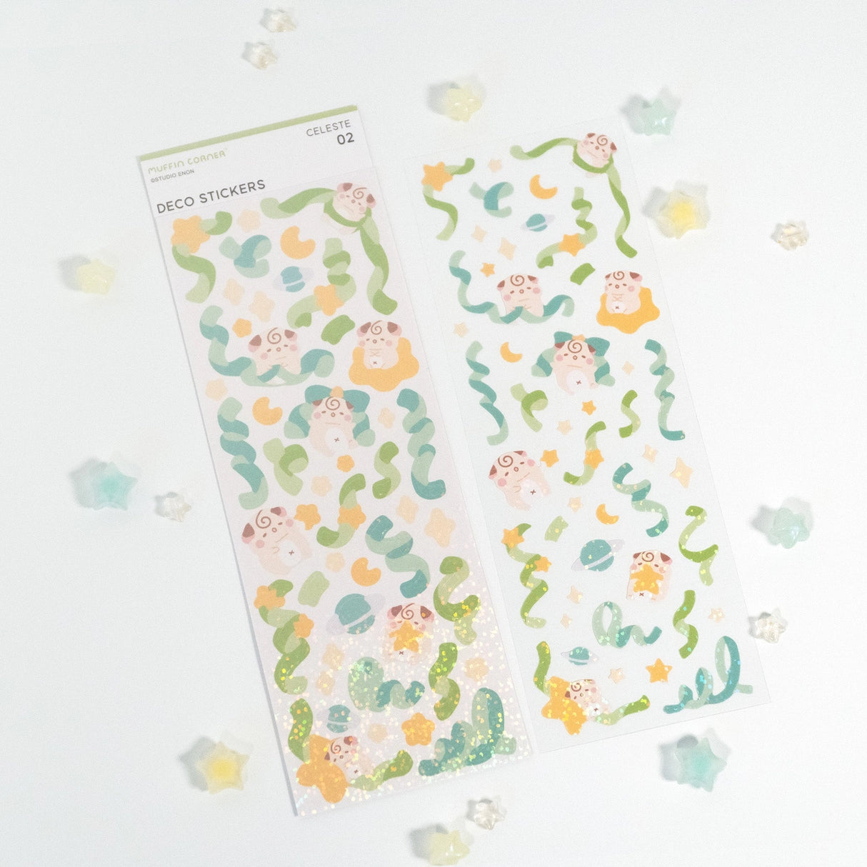The Cocoroll Sweets deco sticker sheet features Cocoroll playing among the stars. Available in blue and green versions, these cute deco stickers are the perfect addition to any polaroids/toploaders, journals, and more. The sparkly holo overlay adds an extra touch of shine and magic.
Dimensions: 2.7” x 8" (6.8cm x 20.5cm)
Quantity: 1 sheet