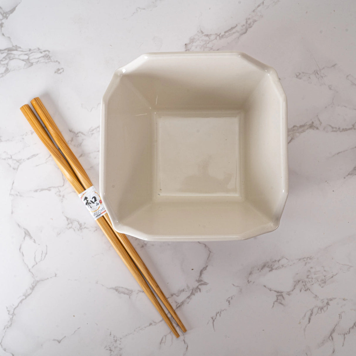 Everything tastes better in a to-go container…but this one is designed to be reusable
Bowl Size: 5" Dia x 4"H
Chopsticks 9"L
Capacity: 16 fl oz
Material: Ceramic
Microwave and Dishwasher Safe
Origin: China