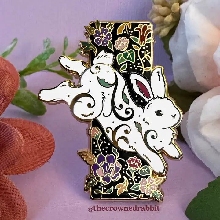 A leaping rabbit from the magical garden!
✦ Hard enamel
✦ Shiny gold metal
✦ 2 inches
✦ 2 Posts for extra security
✦ Rubber backings
✦ Back stamped for authenticity
Comes packaged on a backing card.