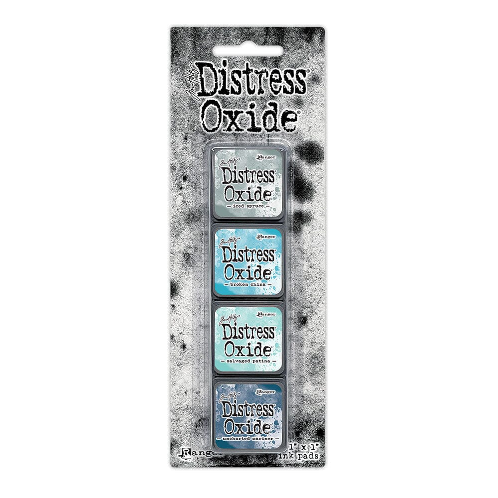 Tim Holtz Distress Mini Oxide Ink Pads are a collection of 1 x 1 cubes featuring water-reactive dye & pigment ink fusion that creates an oxidized effect when sprayed with water.