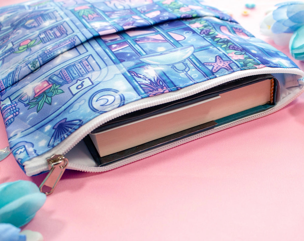 Unicorn Eclipse - Reading Room Book Sleeve
✧Size & Materials✧
Approximate size (WxH): 9 x 12 in
Padded, includes zipper and back pocket
Polyester canvas
Fits our 7x9" notebook, books, 11 in Ipad Pro model, tablets (do your own measurements)