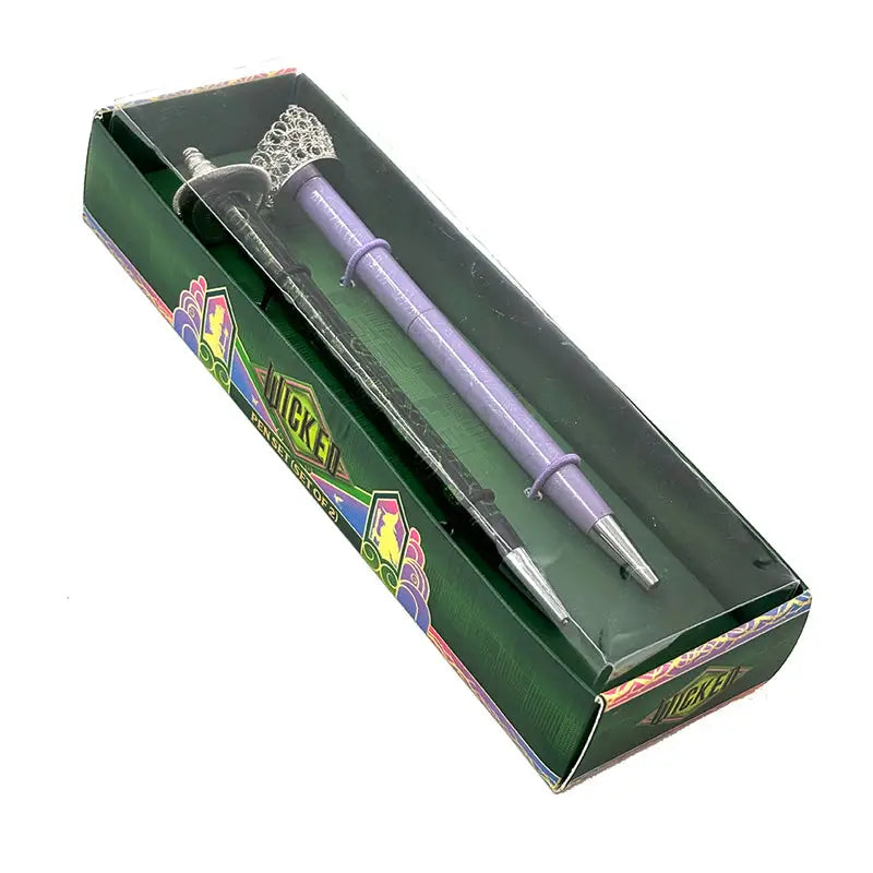 Celebrate your love of Wicked with this set of two ballpoint pens, perfect to use for writing notes, spells, or letters home from your time at Shiz University.
DETAILED DESIGN: This deluxe set contains two ballpoint pens with designs inspired by both Elphaba and Glinda. Each pen features a detailed silver, die-cast metal topper of Elphaba hat and Glinda’s crown.
PERFECT FOR FANS: This pen set makes a wonderful gift and is a perfect way to show your love for Wicked and the beloved characters of Elpha