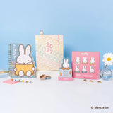 Plan the year with Miffy by your side! This slim 17-month planner (Aug. 2026–Dec. 2027) features monthly planning pages, full-color illustrations, tear-out shopping and to-do lists, and a handy interior pocket. A brass-and-enamel Miffy bookmark adds a charming touch while keeping your place with ease. 

• 7.5"w × 9.75"h 
• 17 months (Aug. 2026–Dec. 2027) 
• 48 pages; 120 gsm acid-free FSC®-certified paper 
• Softcover; Center-sewn binding 
• Brass and enamel bookmark 
• Elastic band closure 

© Mercis bv