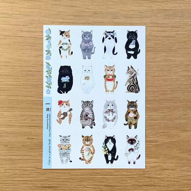 This is a sheet sticker from the series Cat in the Picture Book. This sticker sheet features 16 different cat illustrations. Each sticker feels like a tiny story—perfect for adding personality to journal spreads, scrapbooks, pen‑pal letters, and handmade cards.

Size: approx. 3.75in x 4.75in
Contents: 1 sheet