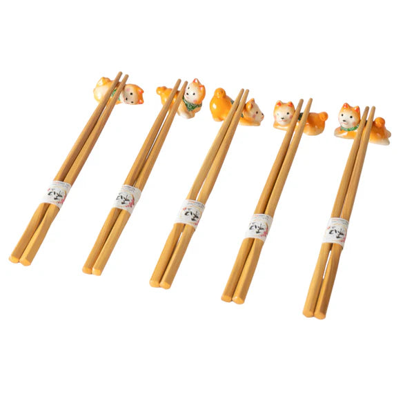 5 Pair Bamboo Chopsticks and Shiba Porcelain Chopsticks Rest Gift Set. This Chopstick and Rest Gift Set Comes 5 Pair Bamboo Chopsticks with 5 piece assorted cats chopsticks rest in gift box packaging. Chopstick Rests are Dishwasher Safe. Gorgeous Box, Perfect Asian Gift for Holidays and any Occasion.

Size: 9 inch chopsticks, 2.25 inches W chopsticks rest
Material: Bamboo and Ceramic
Origin: China