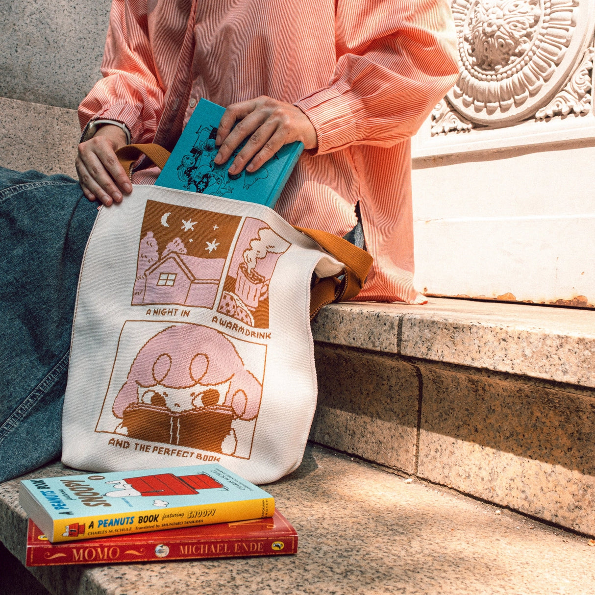 Made in collaboration with KNT365, this bag is made from recycled materials and is a great statement piece for your outfit! The book collection is perfect for book lovers of all kinds, whether you love fiction, non-fiction, or picture books. 📚

Recycled polyester (one tote bag is made from approximately 2 recycled plastic bottles)
31 x 31cm, gusset 30 x 11cm, shoulder strap 75cm
Easily clean the bag by tossing it into the washing machine (laundry net recommended)
Wrinkle free, so feel free to fold away whe