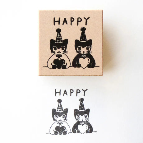 Stamp by illustrator Aiko Fukawa.
It depicts a pair of cats wearing matching party hats and hugging their hearts tightly.
It's also wonderful to mark on gift cards or in a diary of days when good things happened.