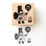 Stamp by illustrator Aiko Nukawa.
The rabbit fairy holds a balloon—a very cute design.
It cutely brightens up the blank spaces on cards and notebooks.