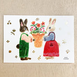 The gold foil stamping on the entire postcard shines brightly.
Full color printing is also applied to the back side.
It is also recommended to accompany gifts to loved ones or display them as an interior decoration in your room.

4 in x 6 in
Includes 1 post card