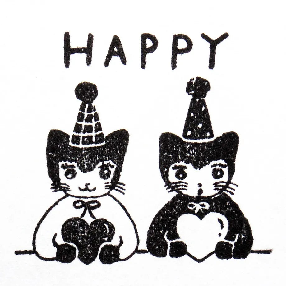 Stamp by illustrator Aiko Fukawa.
It depicts a pair of cats wearing matching party hats and hugging their hearts tightly.
It's also wonderful to mark on gift cards or in a diary of days when good things happened.