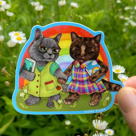 Allison Stoiser Art - Rainbow Gal Pals Bookish Cats Vinyl Sticker


Nothing to see here! Just a couple of gals being pals and going on a reading date at the park. This Russian blue cat and her tortoiseshell cat companion can't wait to sit under a shady tree and read the books they just picked out at their favorite bookstore!