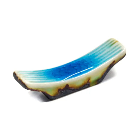 These cute ceramic rests are a perfect stationery addition to your desk! Use them for pens, paint brushes, or take them to your kitchen as a chopstick rest!

Size: 2.5"L x 0.75"H
Material: Porcelain
Weight: 1.6 oz
Origin: China