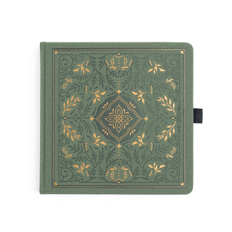Introducing the Storybook Notebook, featuring an intricate full cover design inspired by vintage special edition books, part debossed and part hand stamped with gold foil on a vintage olive vegan leather cover. This design spans the full notebook, with special debossed and foiled details on the back cover, spine and front cover.