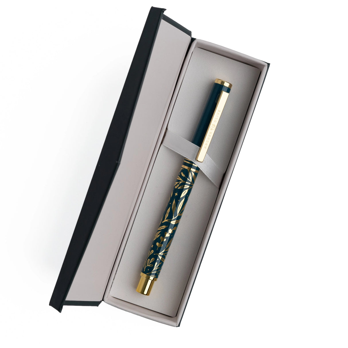 A beautifully designed craft knife featuring a deep teal barrel adorned with gold botanical detailing. With its precision blade and sturdy metal construction, this tool brings both function and elegance to journaling, scrapbooking, and detailed paper crafting.

Specs &amp; Details:

Material: Metal body with gold accents
Design Theme: Teal barrel with gold botanical illustration
Blade: Precision craft blade (replaceable)
Features: Removable cap for safe storage, textured grip for control
Use: Ideal for cutt