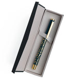 A beautifully designed craft knife featuring a deep teal barrel adorned with gold botanical detailing. With its precision blade and sturdy metal construction, this tool brings both function and elegance to journaling, scrapbooking, and detailed paper crafting.

Specs &amp; Details:

Material: Metal body with gold accents
Design Theme: Teal barrel with gold botanical illustration
Blade: Precision craft blade (replaceable)
Features: Removable cap for safe storage, textured grip for control
Use: Ideal for cutt