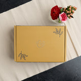 Nurture your creativity with the Flourish Self Care Box, a beautifully curated collection designed with mental wellness in mind. Designed with intention, this box brings together everything you need to begin (or return to) a meaningful creative practice.

Inside you will find: 

A5 Bloom & Grow Notebook: featuring a full cover printed abstract floral design, hand stamped with gold foil accents on a vegan leather cover.

Writing Set: including a 0.5mm Ballpoint Pen and Mechanical Pencil with Eraser, both emb