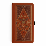 Let your creativity buzz with warmth and intention. The Keeper of the Bees Notebook in Rust blends golden honeybee symbolism with rich, earthy tones, creating a journal that feels both enchanting and grounding. Perfect for capturing ideas, documenting your days, or exploring your imagination—this notebook turns every page into a moment of magic.