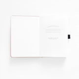 Step into a quiet night where ideas glow like fireflies. The Moonlit Garden Notebook captures the calm of a starry sky framed by wildflowers, inviting you to pause, breathe, and fill each page with inspiration. With soft moonlit tones and delicate detailing, it’s a peaceful companion for journaling, planning, or creative reflection.