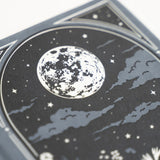 Step into a quiet night where ideas glow like fireflies. The Moonlit Garden Notebook captures the calm of a starry sky framed by wildflowers, inviting you to pause, breathe, and fill each page with inspiration. With soft moonlit tones and delicate detailing, it’s a peaceful companion for journaling, planning, or creative reflection.