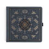 Let your imagination wander into midnight magic. The Storybook Notebook in Navy blends deep, velvety blue tones with ornate gold detailing, creating a journal that feels like an heirloom tale waiting to be written. Whether you're crafting daily reflections or exploring new creative ideas, each page becomes its own enchanting chapter.
