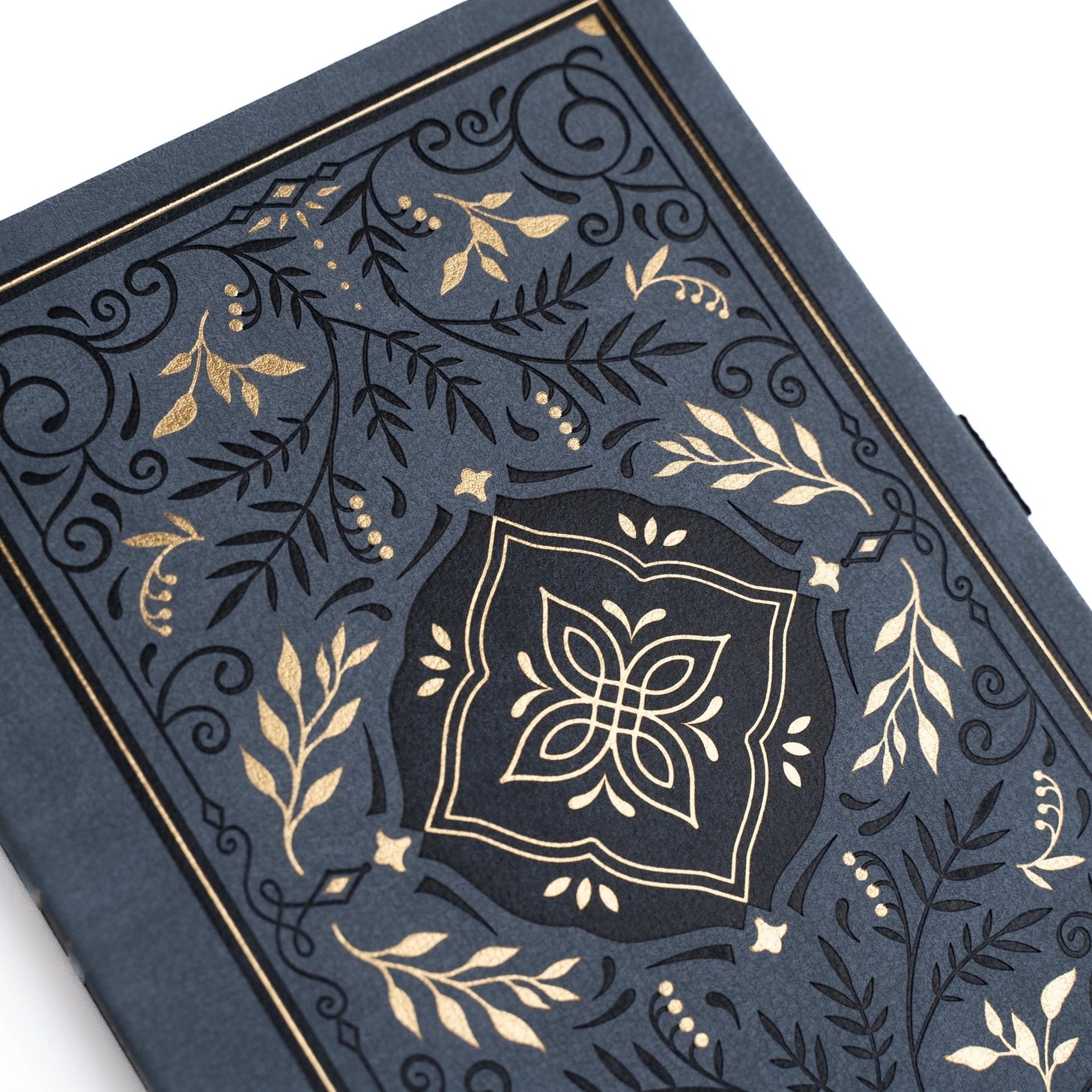 Let your imagination wander into midnight magic. The Storybook Notebook in Navy blends deep, velvety blue tones with ornate gold detailing, creating a journal that feels like an heirloom tale waiting to be written. Whether you're crafting daily reflections or exploring new creative ideas, each page becomes its own enchanting chapter.