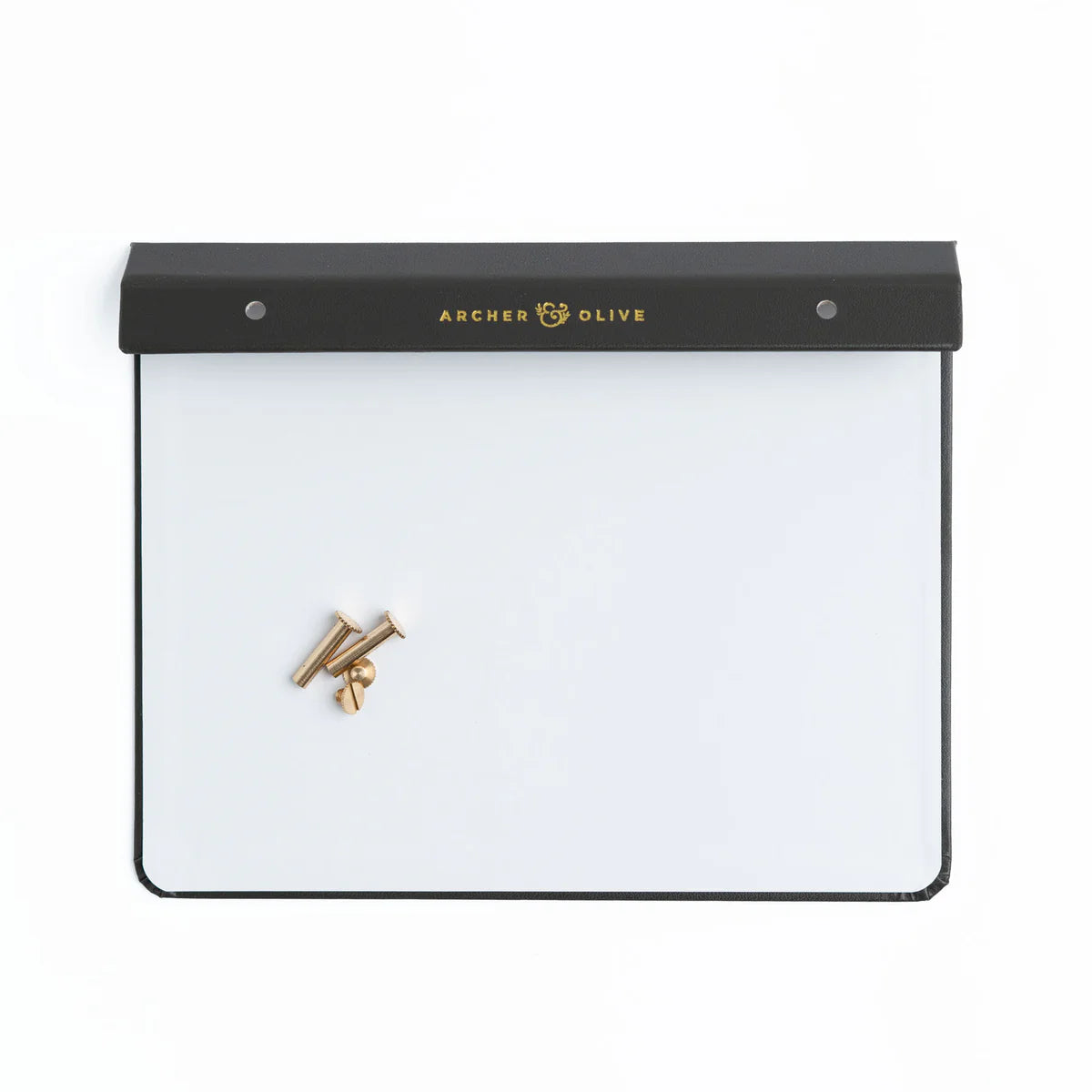Create your own Notepad with our Notepad Backing + Screws + Box Set. Designed to securely hold your notepad pages with a luxurious finish.

Each set includes:

A sturdy cardboard and vegan leather backing, finished with a gold foiled Archer and Olive logo.
Size: A5
2 gold metal binding screws to secure any Archer and Olive Notepad Refill to the backing.
Durable outer box to store your completed notepad once you create it.
This backing system pairs perfectly with our notepad refills, allowing you to easily a