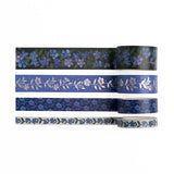Bring elegant floral charm to every journal spread with the&nbsp;Wild Periwinkle Washi Tape Set.

This coordinating collection of four exclusive washi tapes features hand-painted periwinkle blooms, delicate botanical patterns, and shimmering silver foil accents.