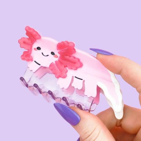 Axolotl Hair Claw' Hair Accessory by Turtle's Soup.

Includes one (1) hair claw
Claw is roughly 3"
3D, engraved, printed, and painted details
High quality acetate material, stronger than standard hair clips
Themed packaging