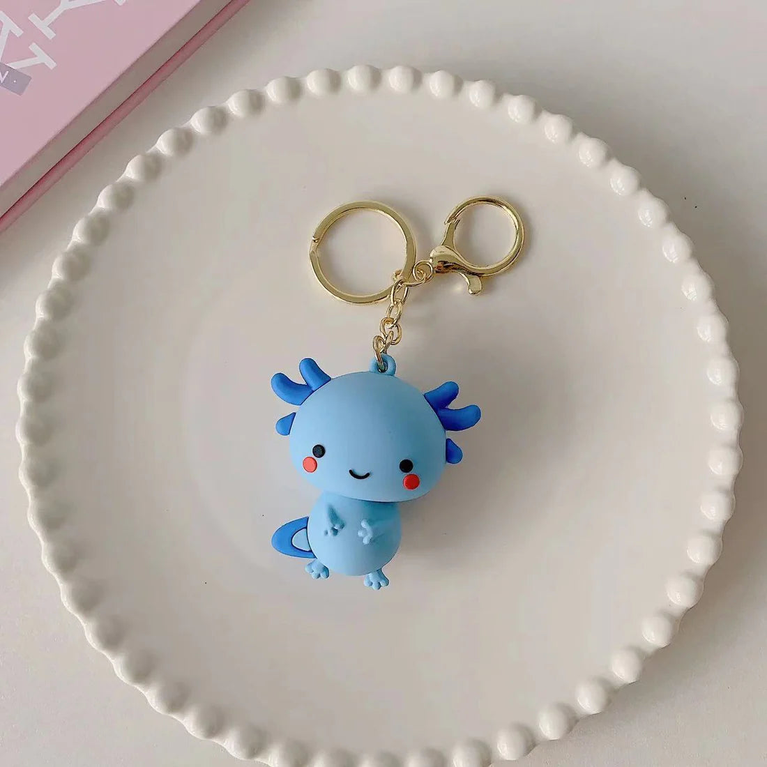 This adorable keychain adds personality wherever you go, whether clipped to your keys, bag, or backpack. Cute, lightweight, and easy to gift, it’s perfect for anyone who loves whimsical accessories or axolotl-themed goodies. 
