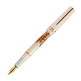 BENU presents the newest Haute Collection — a line of elegant, fashion-inspired pens that blend classic charm with bold, modern flair. The designs include both subtle and vibrant styles, showcasing BENU’s signature glitter and color artistry. Each pen features a faceted body with alternating wide and slender facets, complemented by either gold-plated or chrome-plated trims for a sleek, timeless look.

A mix of golden flakes dances through a soft, pearly pink base, complemented by gleaming gold trim. Tender 