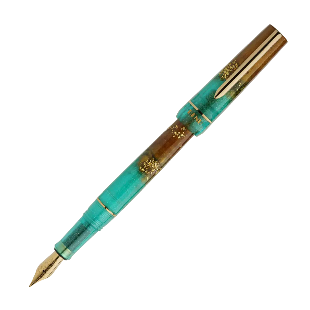 BENU presents the newest Haute Collection — a line of elegant, fashion-inspired pens that blend classic charm with bold, modern flair. The designs include both subtle and vibrant styles, showcasing BENU’s signature glitter and color artistry. Each pen features a faceted body with alternating wide and slender facets, complemented by either gold-plated or chrome-plated trims for a sleek, timeless look.

Seal and caramel tones swirl together, flecked with radiant gold. Lush evokes runway opulence — bold, textu