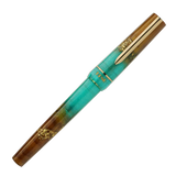 BENU presents the newest Haute Collection — a line of elegant, fashion-inspired pens that blend classic charm with bold, modern flair. The designs include both subtle and vibrant styles, showcasing BENU’s signature glitter and color artistry. Each pen features a faceted body with alternating wide and slender facets, complemented by either gold-plated or chrome-plated trims for a sleek, timeless look.

Seal and caramel tones swirl together, flecked with radiant gold. Lush evokes runway opulence — bold, textu