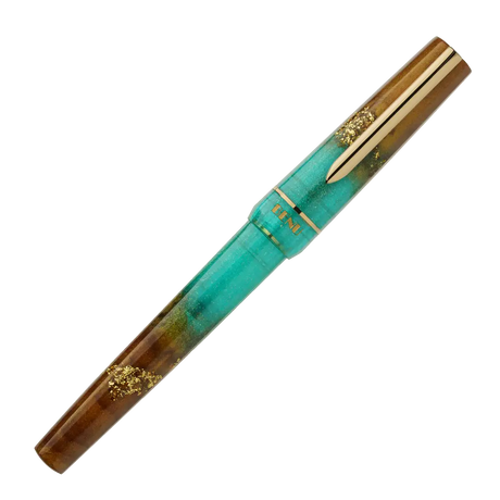 BENU presents the newest Haute Collection — a line of elegant, fashion-inspired pens that blend classic charm with bold, modern flair. The designs include both subtle and vibrant styles, showcasing BENU’s signature glitter and color artistry. Each pen features a faceted body with alternating wide and slender facets, complemented by either gold-plated or chrome-plated trims for a sleek, timeless look.

Seal and caramel tones swirl together, flecked with radiant gold. Lush evokes runway opulence — bold, textu