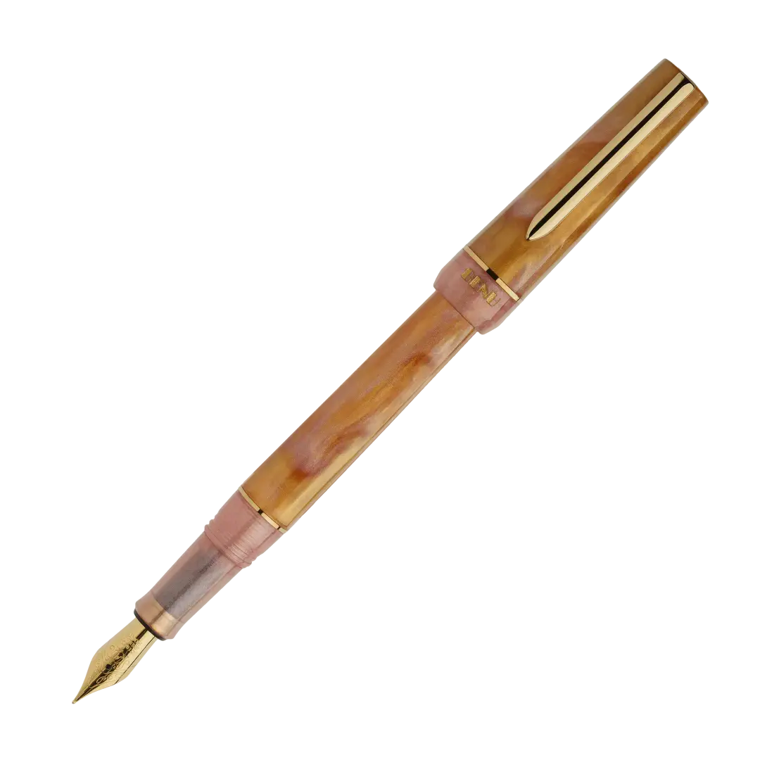 BENU presents the newest Haute Collection — a line of elegant, fashion-inspired pens that blend classic charm with bold, modern flair. The designs include both subtle and vibrant styles, showcasing BENU’s signature glitter and color artistry. Each pen features a faceted body with alternating wide and slender facets, complemented by either gold-plated or chrome-plated trims for a sleek, timeless look.

Lustre pen glows with warm swirls of amber and blush, finished in radiant gold trim.Quietly luxurious, Lust
