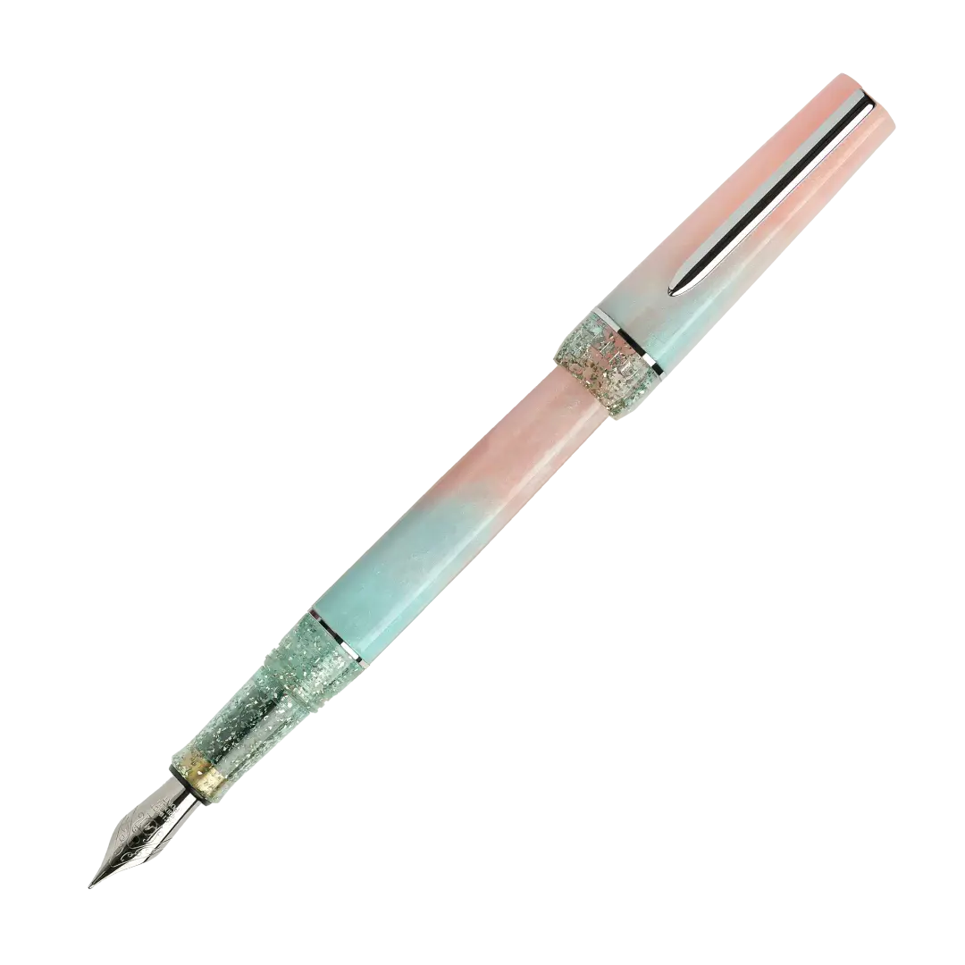 BENU presents the newest Haute Collection — a line of elegant, fashion-inspired pens that blend classic charm with bold, modern flair. The designs include both subtle and vibrant styles, showcasing BENU’s signature glitter and color artistry. Each pen features a faceted body with alternating wide and slender facets, complemented by either gold-plated or chrome-plated trims for a sleek, timeless look.

Soft shades of rose and mint melt together in Perle, accented by a sparkling band. As fresh as spring light