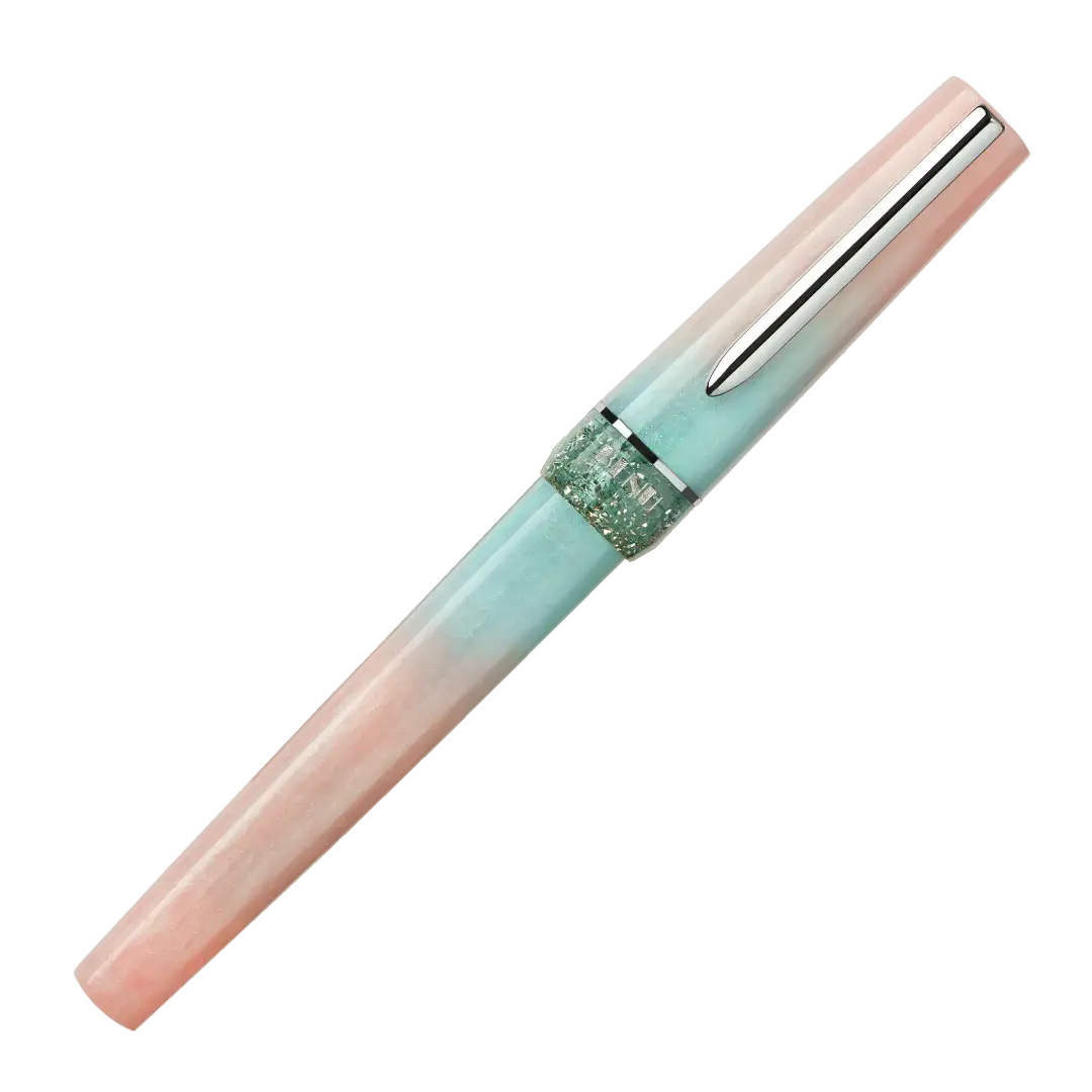 BENU presents the newest Haute Collection — a line of elegant, fashion-inspired pens that blend classic charm with bold, modern flair. The designs include both subtle and vibrant styles, showcasing BENU’s signature glitter and color artistry. Each pen features a faceted body with alternating wide and slender facets, complemented by either gold-plated or chrome-plated trims for a sleek, timeless look.

Soft shades of rose and mint melt together in Perle, accented by a sparkling band. As fresh as spring light
