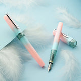 BENU presents the newest Haute Collection — a line of elegant, fashion-inspired pens that blend classic charm with bold, modern flair. The designs include both subtle and vibrant styles, showcasing BENU’s signature glitter and color artistry. Each pen features a faceted body with alternating wide and slender facets, complemented by either gold-plated or chrome-plated trims for a sleek, timeless look.

Soft shades of rose and mint melt together in Perle, accented by a sparkling band. As fresh as spring light