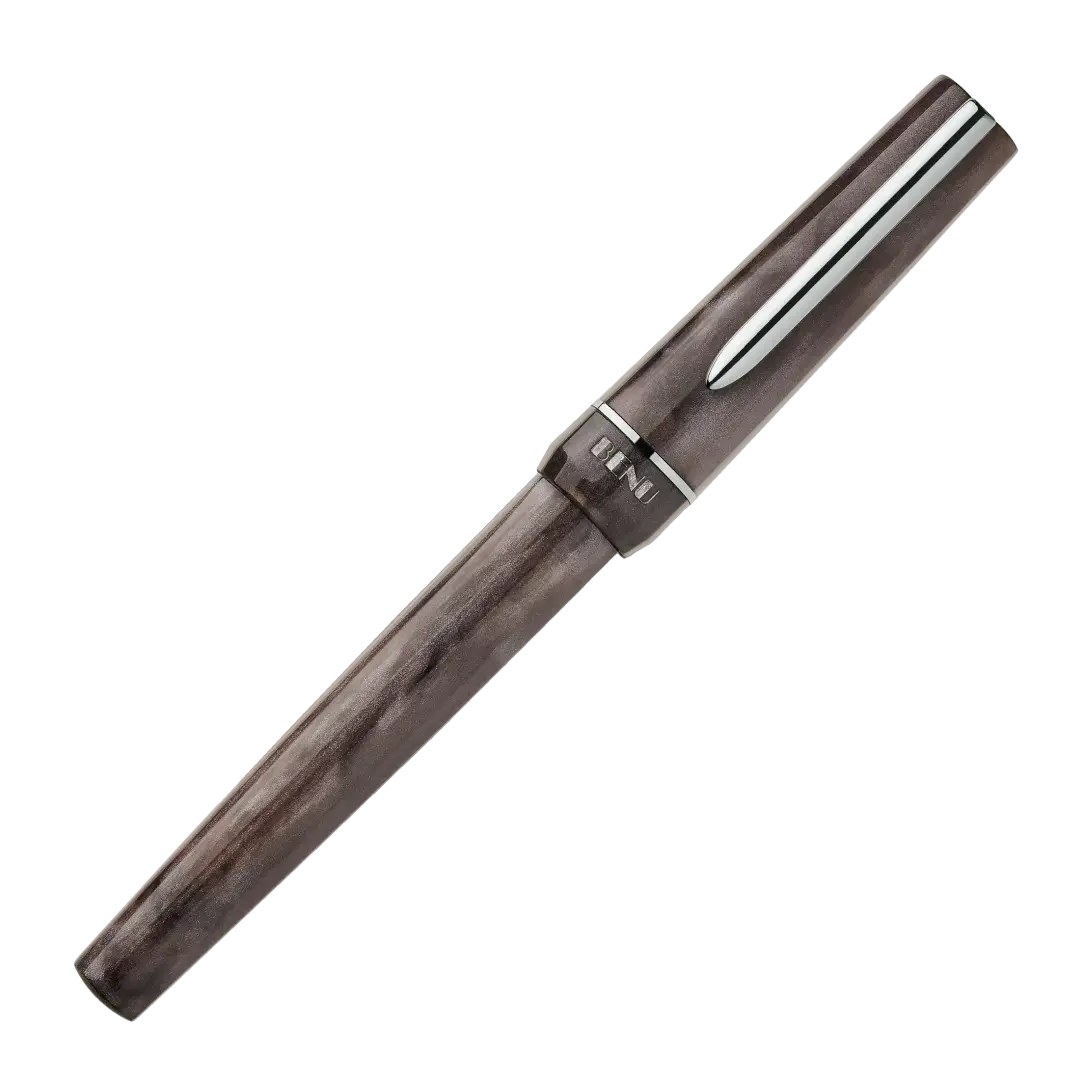 BENU presents the newest Haute Collection — a line of elegant, fashion-inspired pens that blend classic charm with bold, modern flair. The designs include both subtle and vibrant styles, showcasing BENU’s signature glitter and color artistry. Each pen features a faceted body with alternating wide and slender facets, complemented by either gold-plated or chrome-plated trims for a sleek, timeless look.

With smoky gray marbling and polished chrome hardware, Satin is the essence of modern elegance. Understated