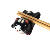 Black Cat Chopsticks Rest

Porcelain black cat chopstick rest / pen rest.