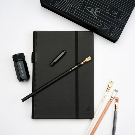 A great way to get started on the Blackwing journey. Give the gift of high-quality Blackwing pencils, paper &amp; accessories — all in one box set.

Includes a Medium Black A5 Slate Notebook, each of our core pencils (602, Matte, Pearl, Natural), One-Step Long Point Sharpener, and Point Guard -- all packaged in a box set.