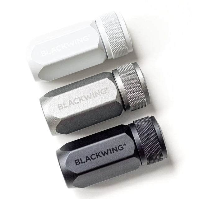 The Blackwing One-Step Long Point Sharpener creates a long, curved pencil point that resists breakage. Its convenient compact design is small enough to fit in the palm of your hand or as a permanent part of your everyday carry. This sharpener is available in black, grey, and white.