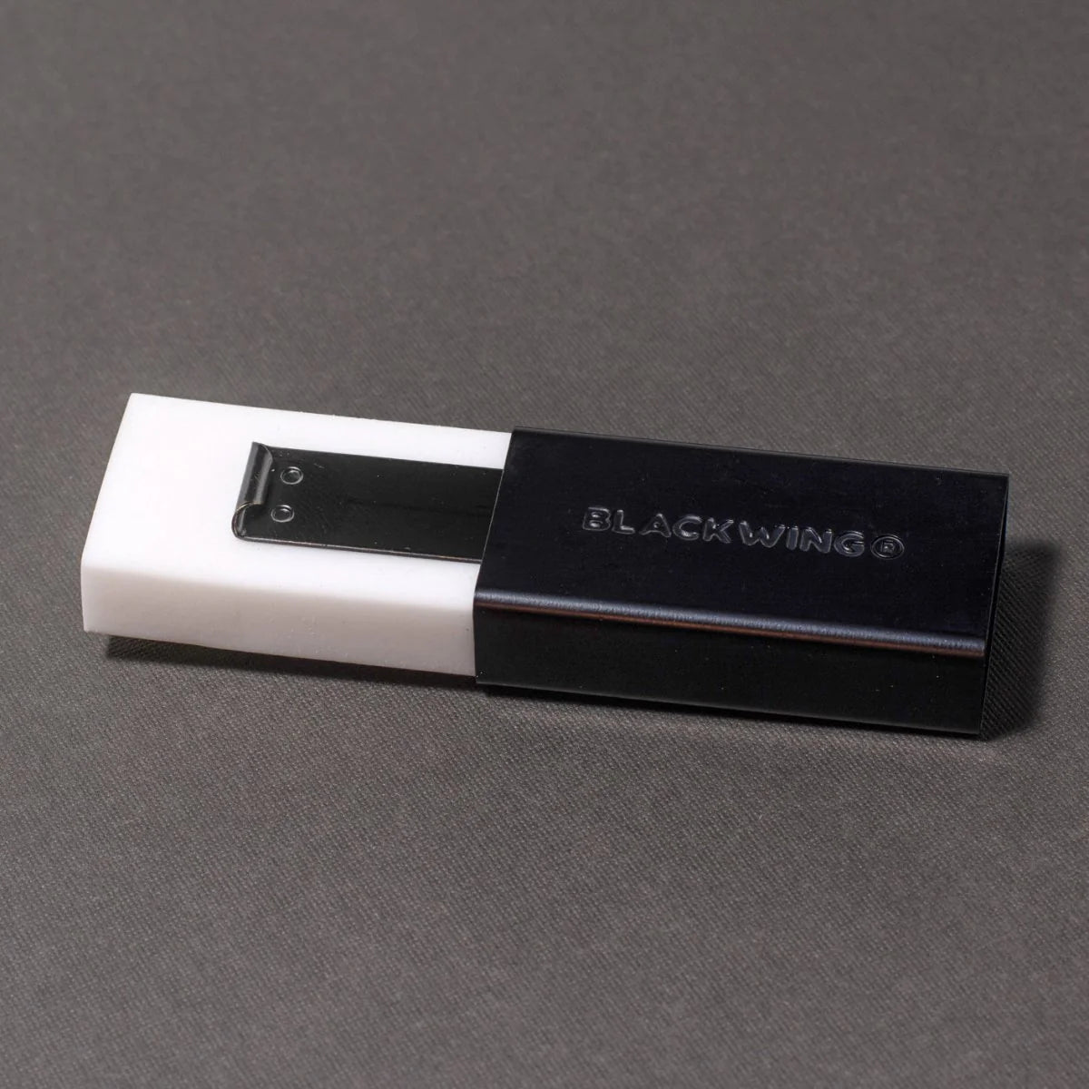 We took the iconic design of our eraser clip and adapted it into a sleek handheld form that feels great to use.

The eraser is made of a special soft material that erases the dark lines of our graphite cleanly and easily. The holder is made of durable aluminum that lets you get a solid grip while erasing. It also includes a jumbo-sized version of the iconic Blackwing clip, so you can extend the eraser as you use it.