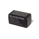 This solid wood pencil display is made with mahogany and is designed to showcase four upright Blackwing pencils. Display the four core Blackwing pencils, or choose four of your favorite designs to add some character to your desk. This display fits well on a desk or shelf, or you can hang it using the predrilled mounting holes. Blackwing logo engraved on the side.

The Blackwing Upright Four Pencil display measures 3.5 x 1.75 x 1.875 inches.