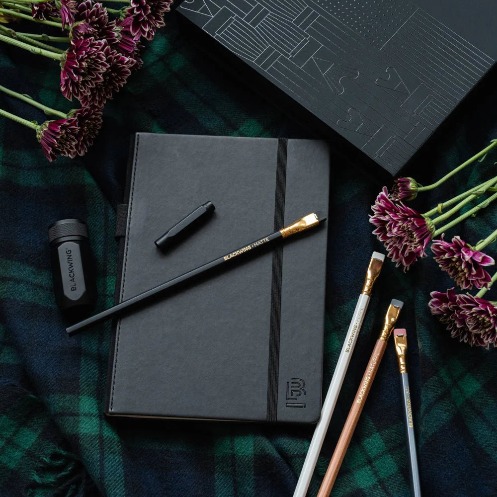 A great way to get started on the Blackwing journey. Give the gift of high-quality Blackwing pencils, paper &amp; accessories — all in one box set.

Includes a Medium Black A5 Slate Notebook, each of our core pencils (602, Matte, Pearl, Natural), One-Step Long Point Sharpener, and Point Guard -- all packaged in a box set.