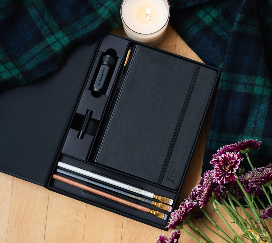 A great way to get started on the Blackwing journey. Give the gift of high-quality Blackwing pencils, paper &amp; accessories — all in one box set.

Includes a Medium Black A5 Slate Notebook, each of our core pencils (602, Matte, Pearl, Natural), One-Step Long Point Sharpener, and Point Guard -- all packaged in a box set.