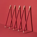 This colorway has a matte red finish, copper imprint, copper ferrule, and light gray eraser. It features a “SOFT” pencil graphite indicator stamp on the barrel. Not to be confused with our red core pencils, this is a graphite pencil with a red barrel. This pencil is ideal for musicians, woodworkers, and anyone who prefers a soft, dark graphite line. The Blackwing Matte is the softest of the four core Blackwing models.

Blackwing Matte pencils come in a 12-pack gift box that also doubles as a pencil cup. The