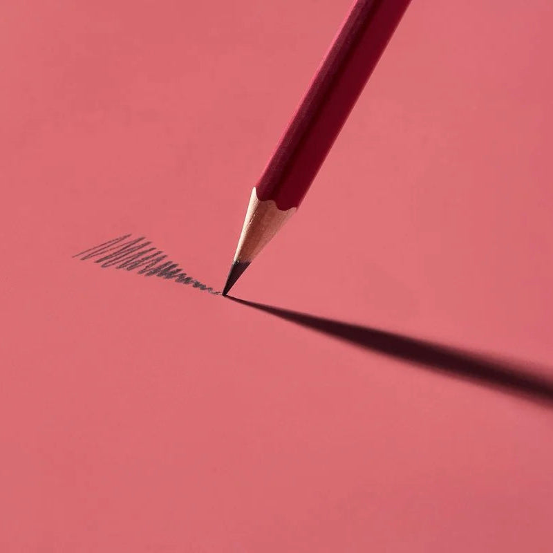 This colorway has a matte red finish, copper imprint, copper ferrule, and light gray eraser. It features a “SOFT” pencil graphite indicator stamp on the barrel. Not to be confused with our red core pencils, this is a graphite pencil with a red barrel. This pencil is ideal for musicians, woodworkers, and anyone who prefers a soft, dark graphite line. The Blackwing Matte is the softest of the four core Blackwing models.

Blackwing Matte pencils come in a 12-pack gift box that also doubles as a pencil cup. The