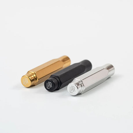 The Blackwing Point Guard is designed to ensure your Blackwing pencil gets wherever you’re going in one piece. Crafted out of lightweight, machined aluminum, the Point Guard goes over the point of your Blackwing pencil, keeping it safe in your bag, pocket, or pencil roll. The tip of your pencil “floats” inside the cap to protect your point against unexpected drops or jams.

Point Guards are available in matte black, matte white, bright gold, bright silver, or a mixed set of 3 (gold, silver, and black).