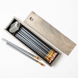 The Blackwing Rustic Box features your choice of 12 premium Blackwing graphite pencils and our reliable Two-Step Long Point Sharpener. Choose from 12 Matte pencils,12 602 pencils, 12 Pearl pencils, 12 Natural pencils, or 3 of each. The aged pine pencil box slides open to reveal the Blackwing pencils and a black cork-lined interior. The smooth stationery box is perfect for any workspace, office, or desk.