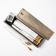 The Blackwing Rustic Box features your choice of 12 premium Blackwing graphite pencils and our reliable Two-Step Long Point Sharpener. Choose from 12 Matte pencils,12 602 pencils, 12 Pearl pencils, 12 Natural pencils, or 3 of each. The aged pine pencil box slides open to reveal the Blackwing pencils and a black cork-lined interior. The smooth stationery box is perfect for any workspace, office, or desk.

All Rustic Boxes now come with our Grey Two-Step Long Point Sharpener.

All Blackwing pencil products co